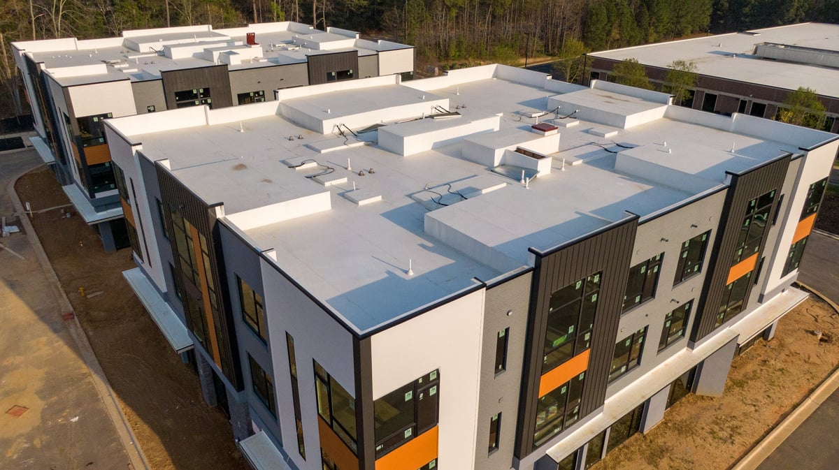 Overhead view of roofing membrane seams and flashing details